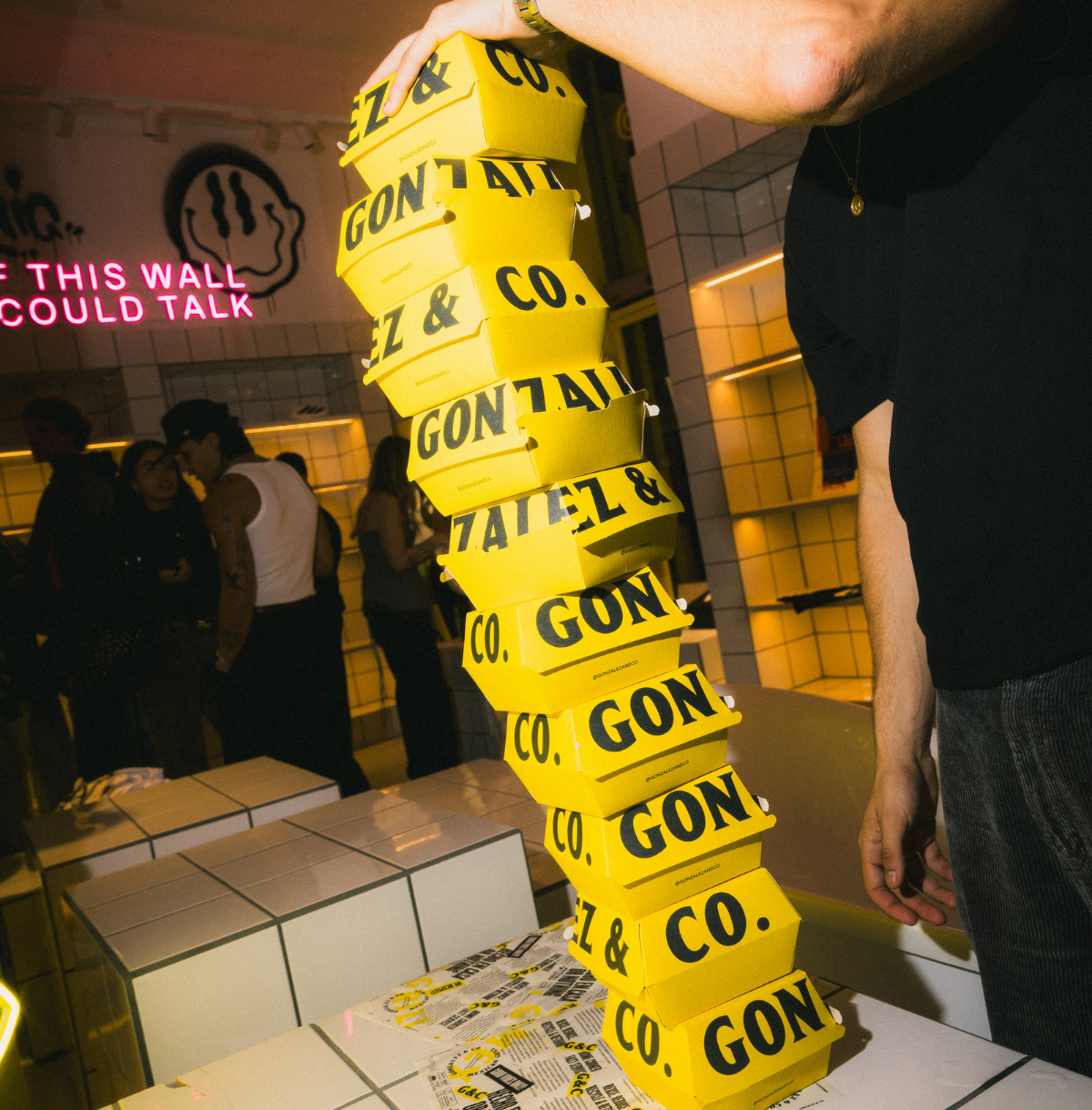 A stack of yellow Gonzalez&Co boxes in the restaurant